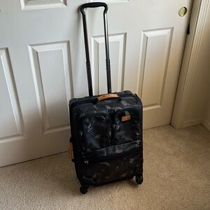 Tumi Alpha Bravo 22-inch 4 wheel carryon luggage; leather accents